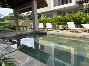 Luxury 3 bedroom and private rooftop oasis including private jacuzzi with sea and mountain views
