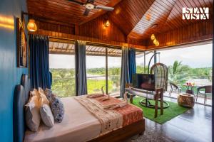 StayVista at Greenwich Meridian with Pool, River & Mountain View