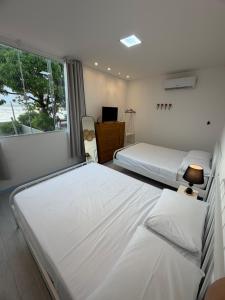 Casa Veiga - Kitnet à beira-mar em Anchieta - ES
