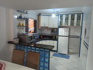 A poucos passos do mar, Casa em Ganchos de Fora