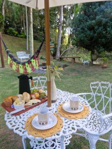 Casa Aconchegante com amplo jardim e fogo de chão