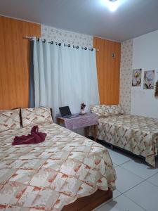 cantinho da Raq,um quarto SUÍTE com ar condicionado duas camas de casal perto doAeroporto, UEPA, Rodoviaria, magueirao, UFPA,parque ambiental,