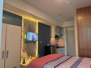 Apartemen Grand Kamala Lagoon by Cozy Room