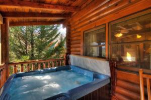Snuggle Up Cabin by Beyond Expectations with Hot Tub