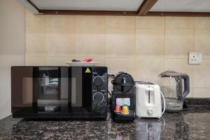 FIRST CLASS 1BR Stylish Getaway in Sports City