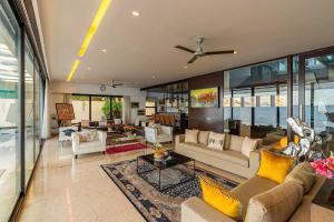 Oceanic Sunsets with River View, Comp Breakfast & Infinity Pool at StayVista