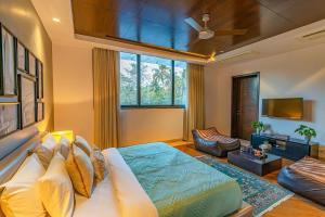 Oceanic Sunsets with River View, Comp Breakfast & Infinity Pool at StayVista