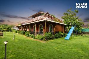 StayVista at Greenwich Meridian with Pool, River & Mountain View