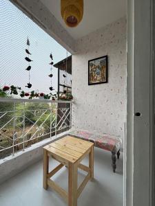 The Golden Mirror A Warm 1BHK with Balcony