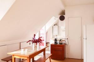 Apartment with balcony under the roofs of Paris