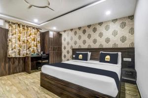 Townhouse OAK SRK White Inn Near Ragigudda Sri Prasanna Anjaneyaswamy Temple