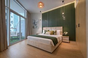 1BR Canal-Front Balcony with Burj Khalifa View - Live Luxe Dubai