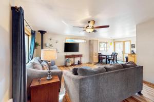 Two-story home with sunroom, large yard, fire pit, & BBQ grill