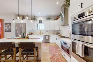 Updated luxury home with ensuite bedrooms, fireplace, & large deck w firepit