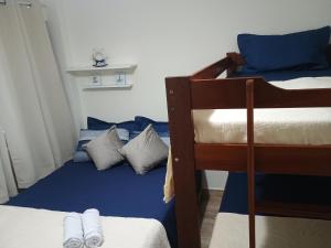 400 mt da Praia da Enseada Wi-fi Estacionamento gratuito cozinha completa