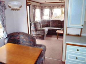 Mobile home in a holiday park with lake access