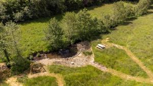 Idyllic countryside cabin with stream and lake