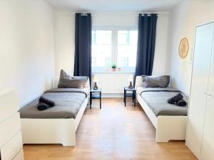 CosyHomes24 - Centrally with parking space and living room - GE11b