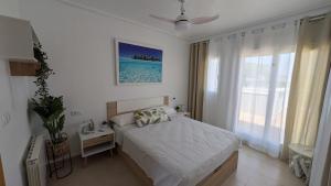 Adosado con espectacular jardín en resort de golf