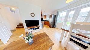 Bayside Cottage - Seaview and Balcony - Part of the The Bay Filey Holiday Village with pool, gym and direct beach access, pub, restaurant, tennis and meadows walks