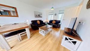 Bayside Cottage - Seaview and Balcony - Part of the The Bay Filey Holiday Village with pool, gym and direct beach access, pub, restaurant, tennis and meadows walks