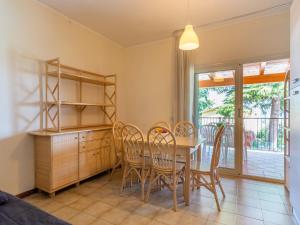 Apartment on Lake Garda with pebble beach, pier for boat, three swimming pools