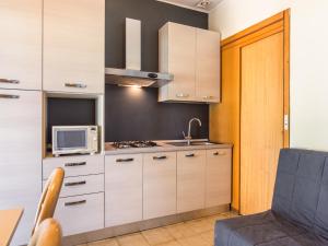 Apartment on Lake Garda with pebble beach, pier for boat, three swimming pools