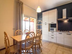Apartment on Lake Garda with pebble beach, pier for boat, three swimming pools