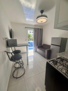 Condo neuf avec balcon prs de tout Sosua 206