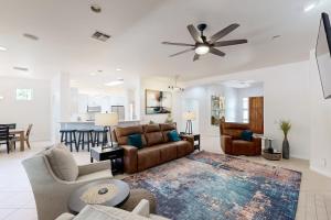 Luxurious remodeled home with gas fireplaces, patios, outdoor kitchen, & pool