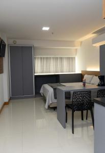 Flat com cozinha e garagem