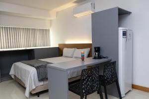 Flat com cozinha e garagem