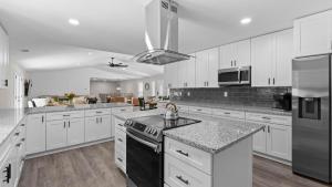 Lakefront Retreat with Private Dock Pool Game Room Sleeps 18