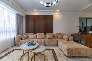 modern executive three bedroom apartment with amazing facilities,high speed wifi,swimming pool,fully equipped gym and close proimity to major shopping malls and restaurants and designated child play area