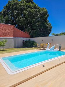 Casa ampla e confortável. Piscina e churrasqueira.