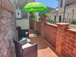 Alloggio con Giardino, Wi-Fi e Aria Condizionata