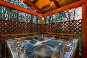 Private Wooded Cabin w Hot Tub, Fire Pit & Arcade