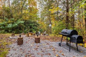 Private Wooded Cabin w Hot Tub, Fire Pit & Arcade