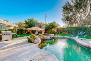 Luxury home with an enclosed yard pool pool spa