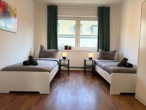 CosyHomes24 - Centrally with parking space, living room and balcony - GE11c