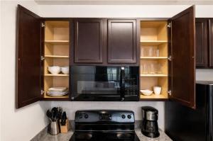 Designer UAB Condo King Bed Balcony View 2