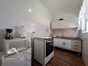 Casa com piscina no Indaiá em Bertioga - Para 8 pessoas