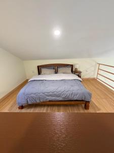 Cozy 2BR Mezzanine Home with Balcony in a Quiet & Central Location