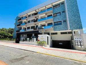 Oásis do Atlântico 303 A - Apartamento elegante na Praia de Palmas, em um condomínio clube completo.