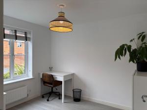 Modern 4-Bed Home with Garden and Parking