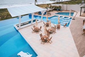 Apê Beira Mar com Ar Cond em Condomínio Clube com Piscina, Churrasqueira, Proximo ao Beto Carrero