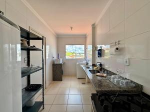 Apartamento de dois quartos com garagem coberta