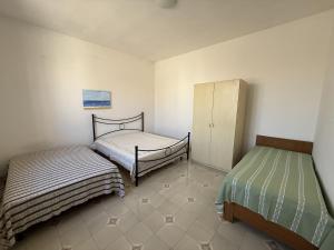 Casa vacanza Ninetta a Torre Lapillo con cortile