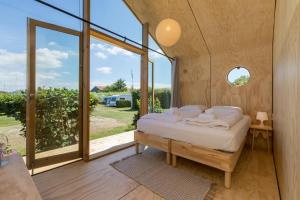 Welcome in - Wikkelhouse met grote tuin en 2 terrassen, Kon Emmaweg 6 Vrouwenpolder