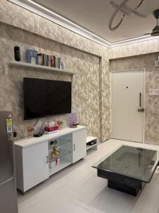 The Golden Mirror A Warm 1BHK with Balcony